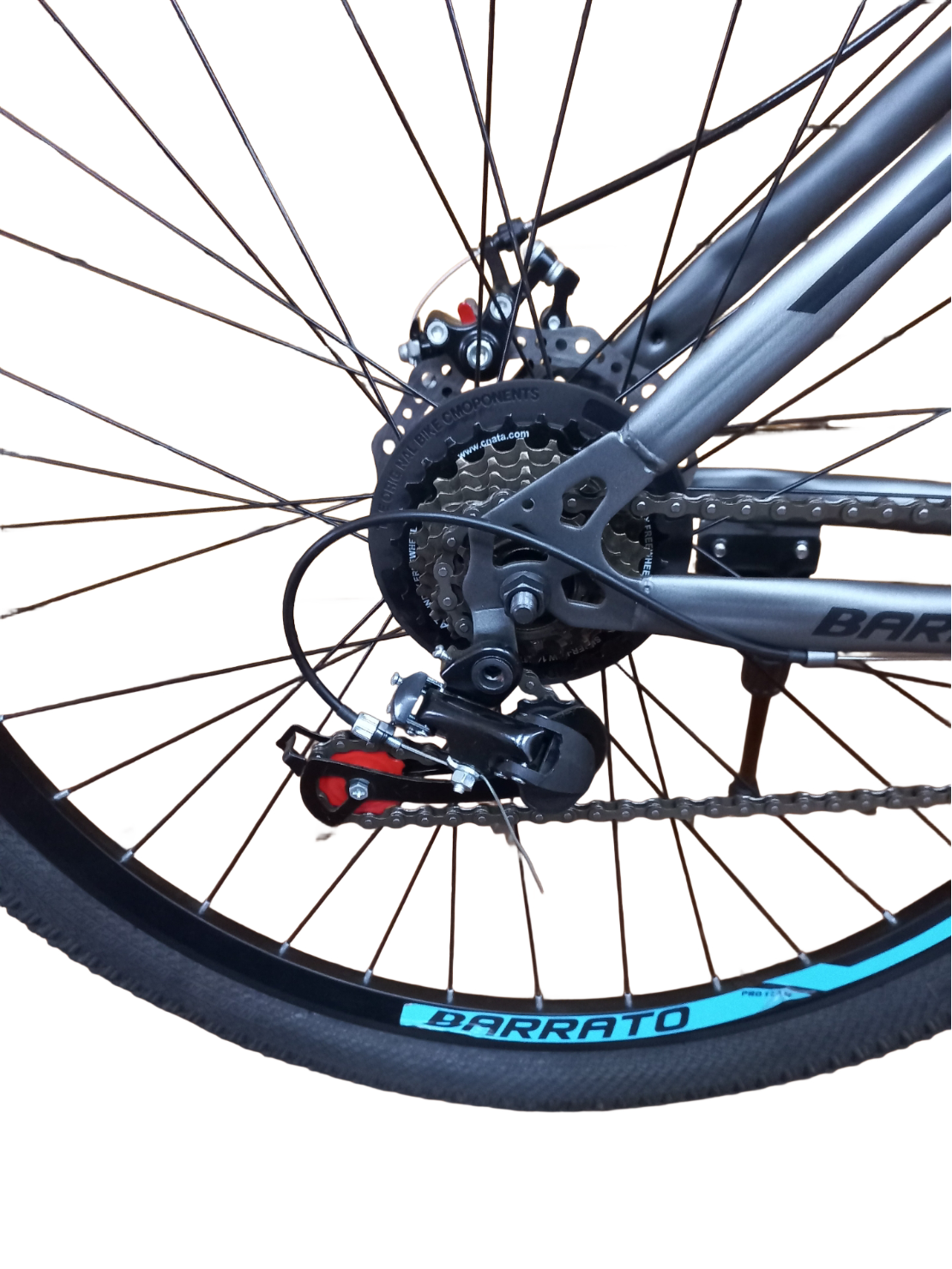 Close-up of a bicycle wheel with gear and chain mechanism on a white background